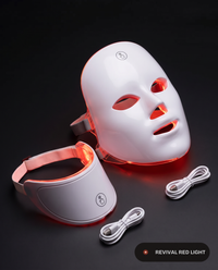 Revival Aura with the optional neck piece, both pieces and charging cables, glowing red