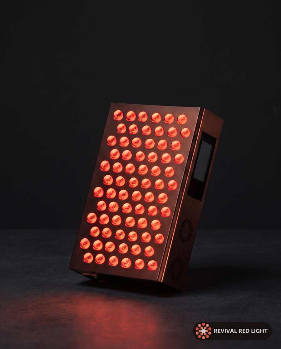 Revival Panel Blaze red light therapy panel, powered on with warm ember glow