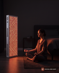 Revival Panel Corona red light therapy panel, lifestyle in-use shot, warm ember glow at night