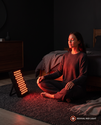 Revival Panel Ember in use, red light therapy panel powered on with warm ember glow