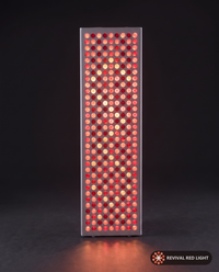 Revival Panel Flare red light therapy panel, front-facing angle, powered on with warm ember glow