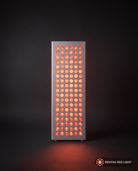 Revival Panel Glimmer red light therapy panel, front-facing angle, powered on with warm ember glow