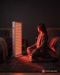 Revival Panel Glimmer red light therapy panel, lifestyle in-use shot, warm ember glow at night
