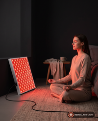 Revival Panel Glow in use, red light therapy panel powered on with warm ember glow